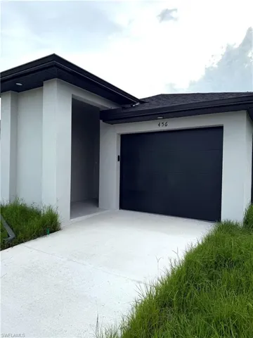 Garage featuring driveway