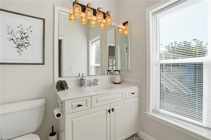 Bathroom with vanity and toilet - Virtually Edited