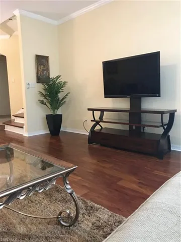 Detailed view of wood finished floors and ornamental molding