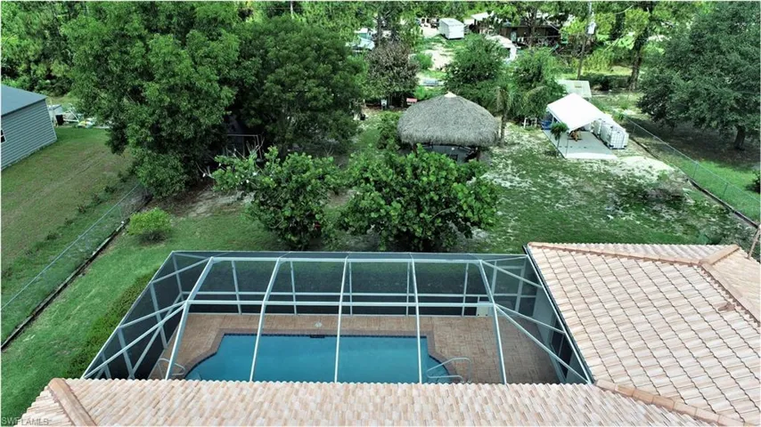 View of pool featuring a lanai