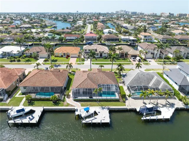 Aerial view featuring a water view and a residential view