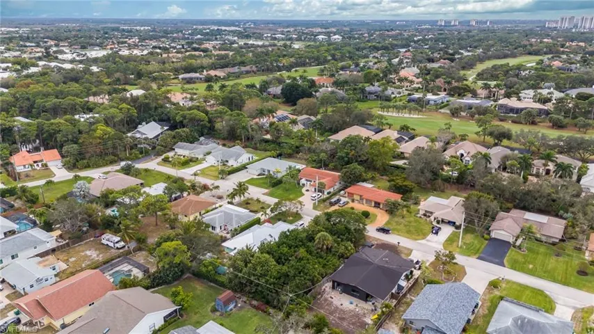 Aerial view of property's location featuring nearby suburban area