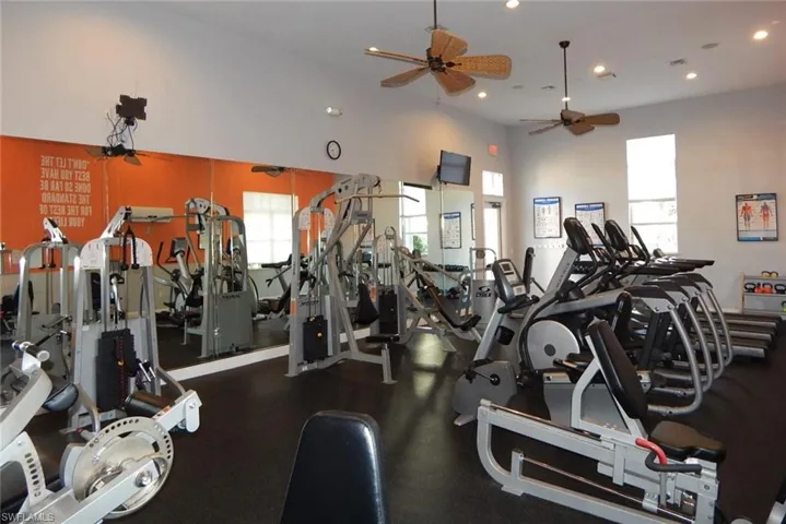 Gym featuring ceiling fan and recessed lighting