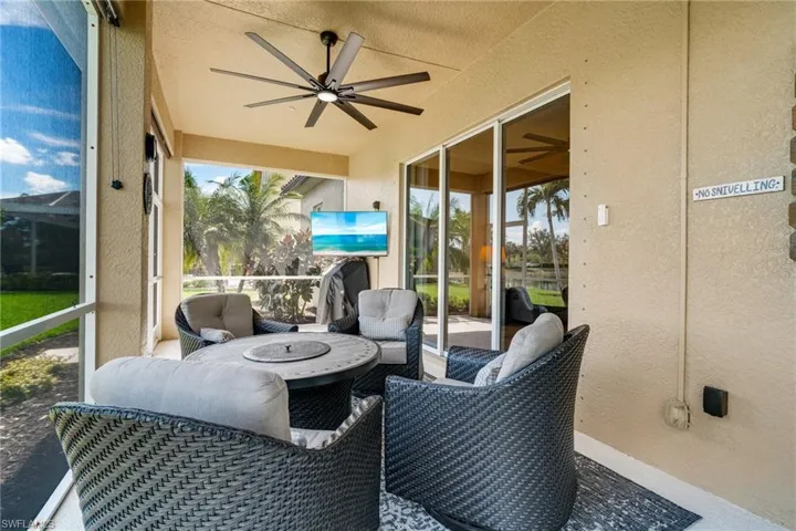 Sunroom with a ceiling fan