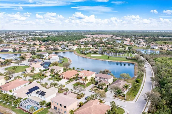 Drone / aerial view featuring a residential view and a water view