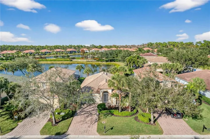 View of property location with a large body of water and nearby suburban area
