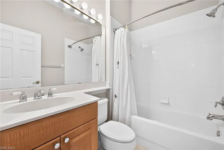 Bathroom featuring vanity and shower / bath combo