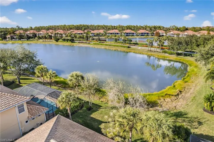 Aerial view of residential area featuring a large body of water