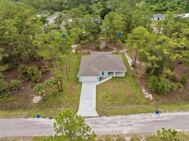 105 wide by 208 deep. The home was built more to the right side of the parcel giving you more access to the rear of the property. Perfect to add another garage or workshop. The rear portion is cleard of most brush but left with some nice trees to shade the backyard