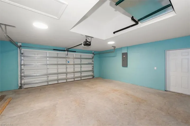 Garage with side door entry. The hvac is recessed above to give more room in the garage, but still give easy access for mantenance