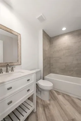 Guest bathroom with a tiled wall shower