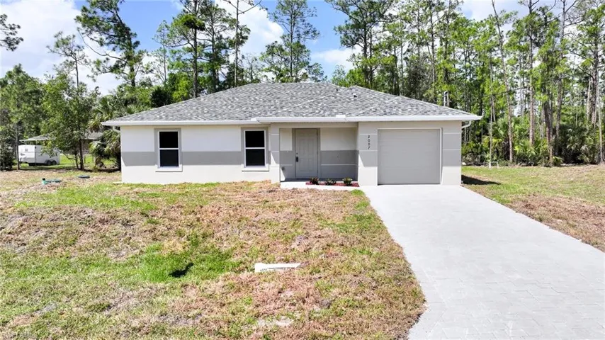 Amazing New Construction! This Brand New 3 Bedroom/2 Bathroom Home On An Oversized .32 Acre Lot With Old Growth Trees In The Greenbriar Neighborhood In Lehigh Acres!