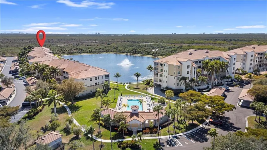 Aerial view of a large body of water and apartment complex