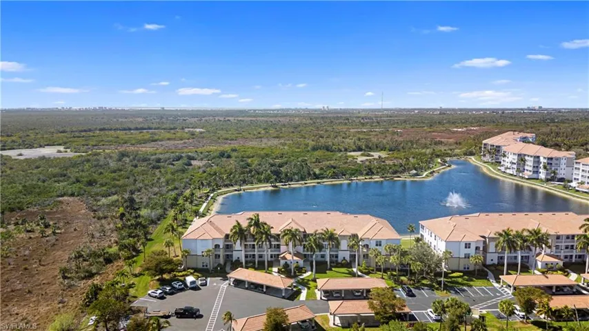 Aerial view of apartment complex / building and a large body of water