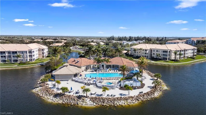 Bird's eye view of a pool area and a large body of water