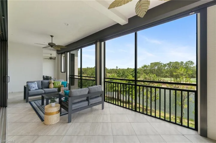 Sunroom / solarium featuring a ceiling fan and healthy amount of natural light