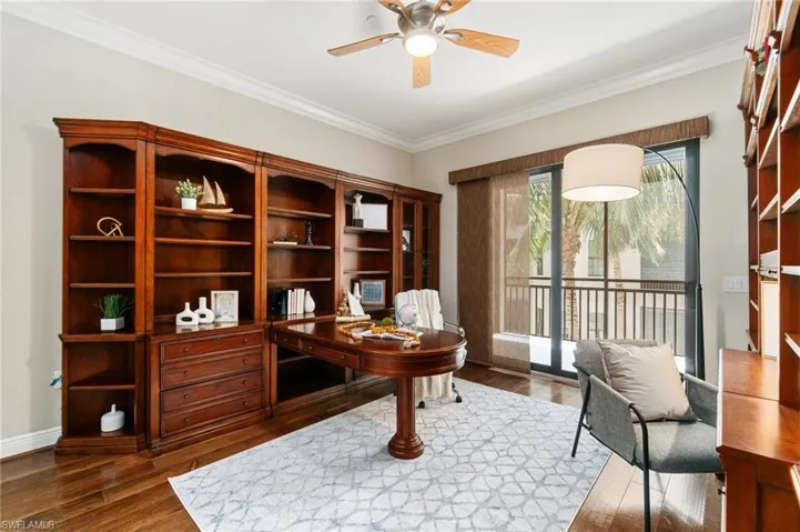 Office featuring ceiling fan, wood finished floors, crown molding, and baseboards
