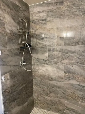 Details with a tile shower