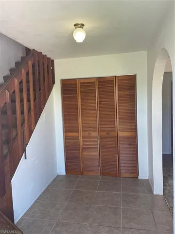 Corridor with tile patterned flooring