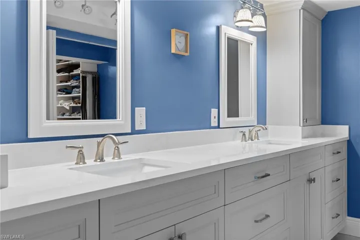 Bathroom featuring double vanity and a sink