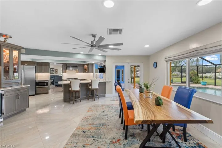 Dining room featuring baseboards, visible vents, ceiling fan, and recessed lighting