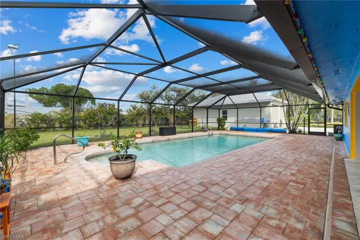 Pool featuring a patio area and a lanai