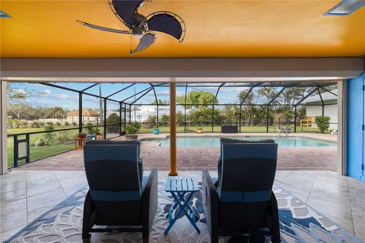 View of patio / terrace featuring a lanai and an outdoor pool