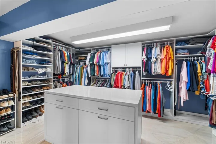 Walk in closet featuring light tile patterned flooring