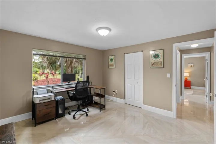Office featuring marble finish floor and baseboards
