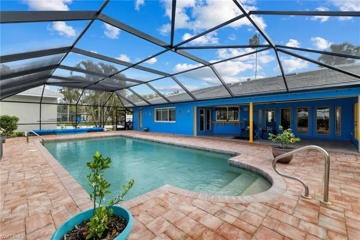 Pool with a patio, french doors, and glass enclosure