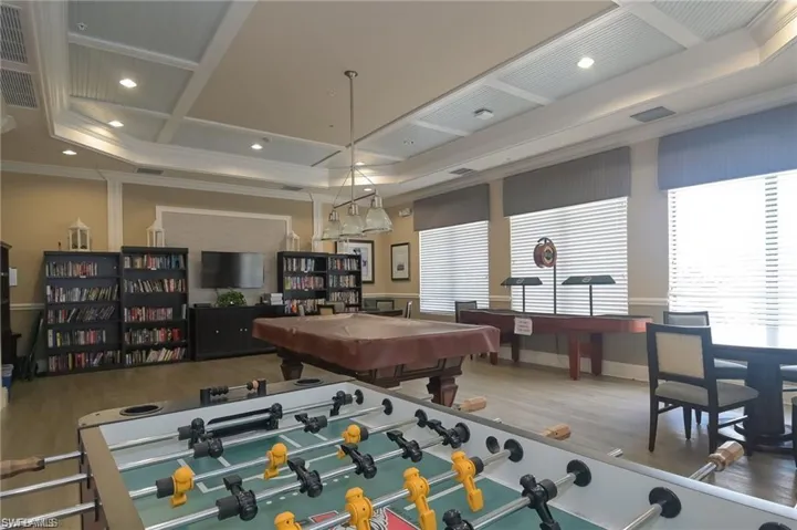 COMMUNITY GAME ROOM WITH BILLIARDS AND FUSEBALL AND BOOKS
