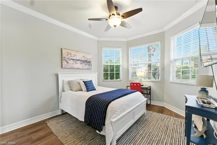 LARGE WINDOWS INTHE FRONT BEDROOM GIVE TONS OF NATURAL LIGHT, CUSTOM CLOSET SHELVES, LUXURY VINYL FLOORS, QUEEN BED