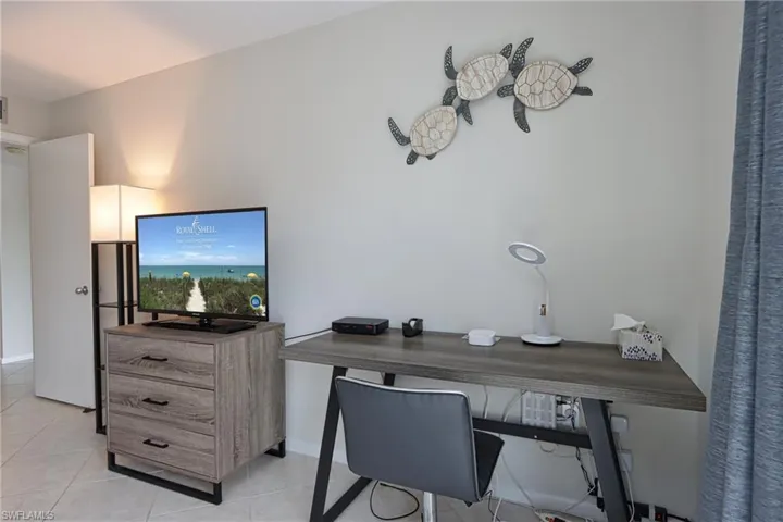Office area featuring light tile flooring