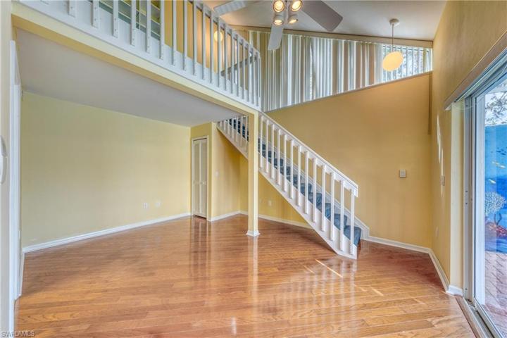 2nd bedroom with a staircase and a loft