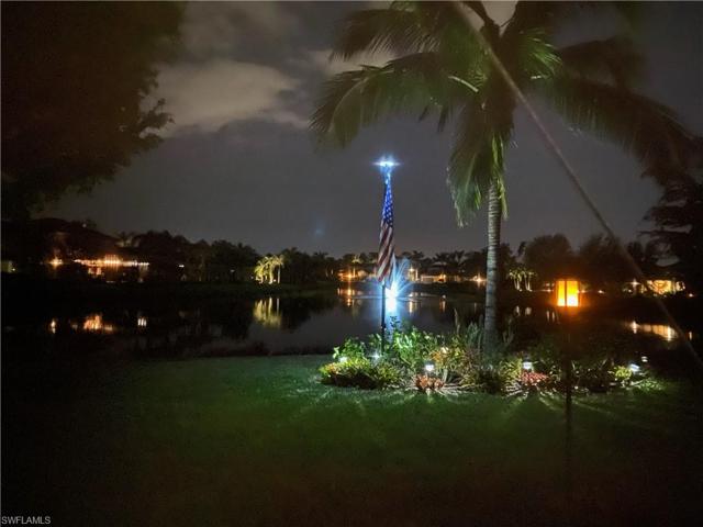 View of lake and fountain at night
