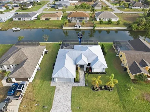 Aerial perspective of suburban area with a large body of water