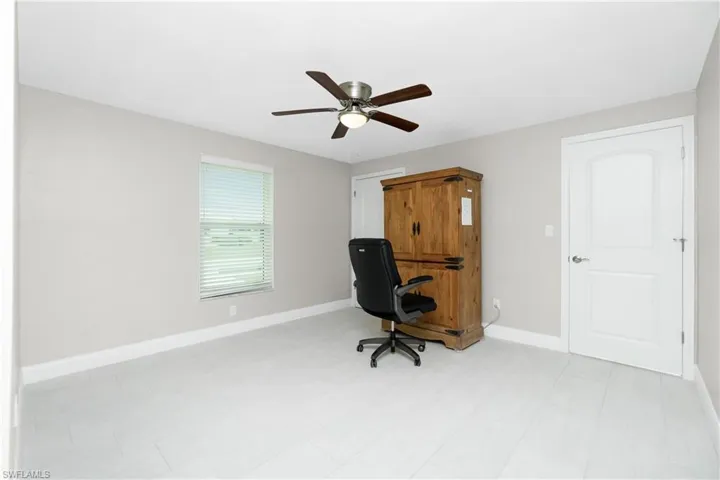 Home office featuring ceiling fan