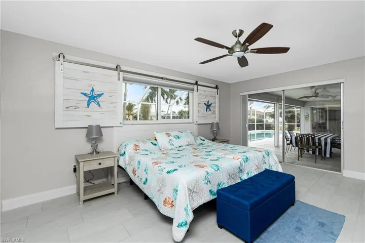 Bedroom featuring access to exterior and ceiling fan