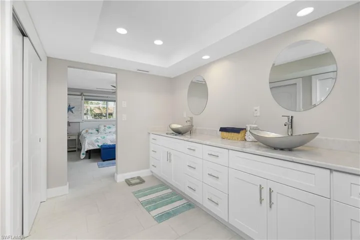 Bathroom with vanity and a raised ceiling