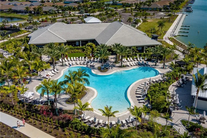 View of swimming pool featuring a patio area and a water view