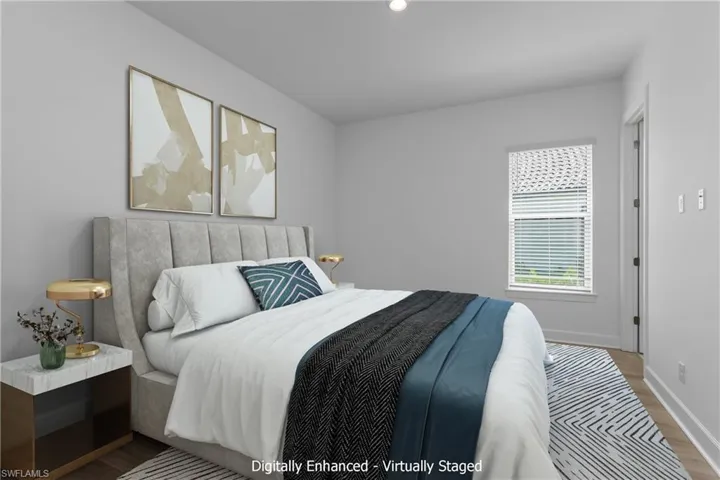 Bedroom with hardwood / wood-style flooring
