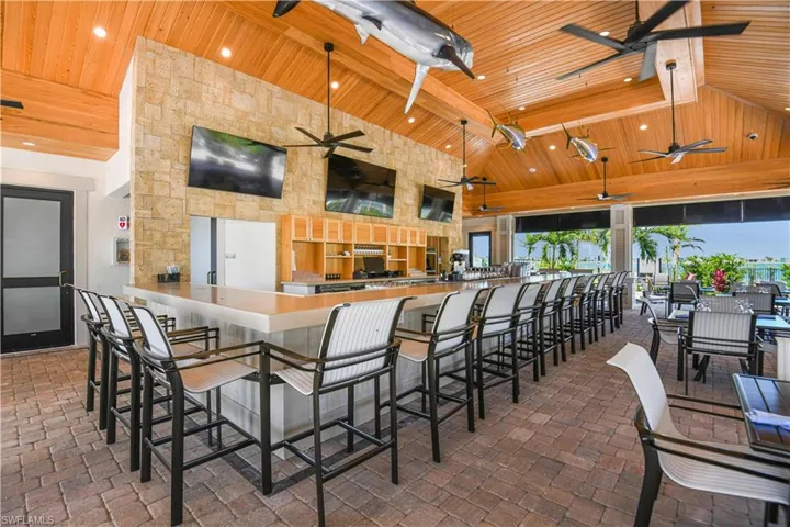 Dining room featuring high vaulted ceiling, ceiling fan, beamed ceiling, and wooden ceiling