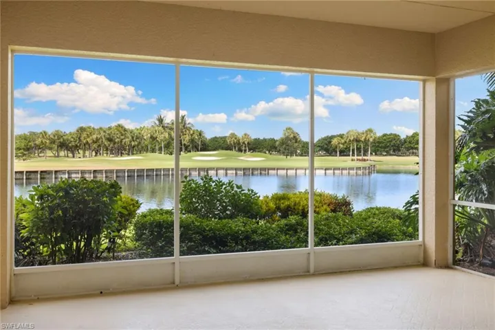 1st Floor Condo with expansive lanai overlooking the 18th hole of Pelican Marsh Golf Course with lush landscape and pond view
