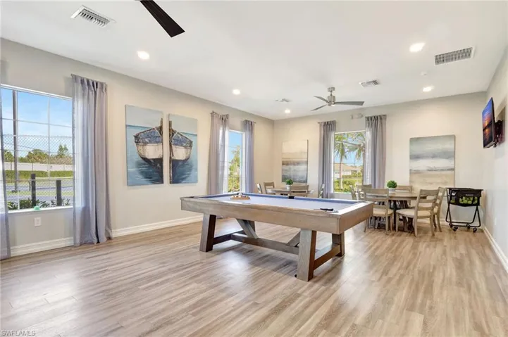 Game room featuring light hardwood / wood-style floors, pool table, and ceiling fan