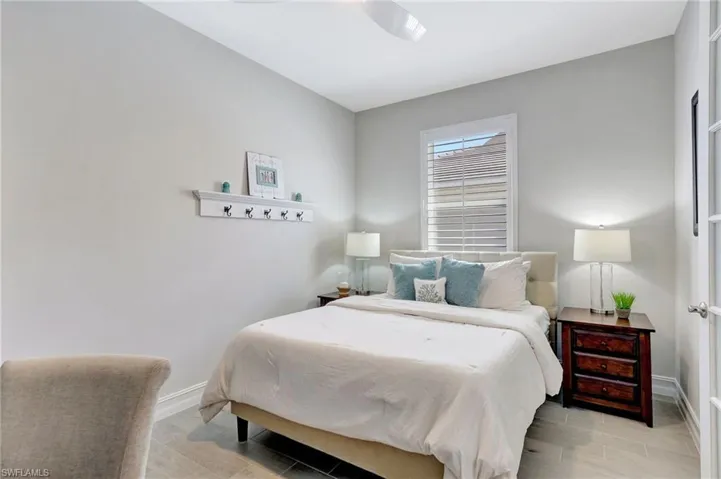 Bedroom with light hardwood / wood-style flooring