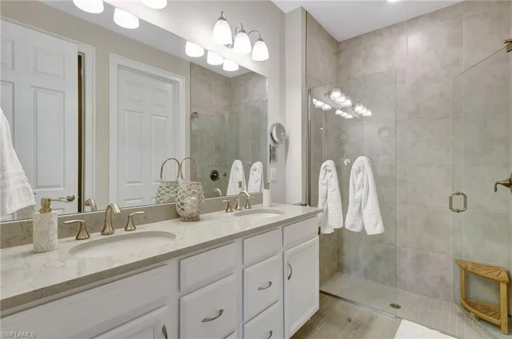 Bathroom with an enclosed shower and vanity