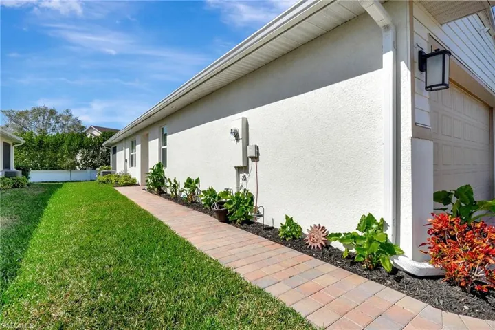 View of home's exterior with a lawn