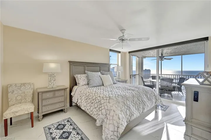 Primary Bedroom with sliding glass doors to Screened Lanai