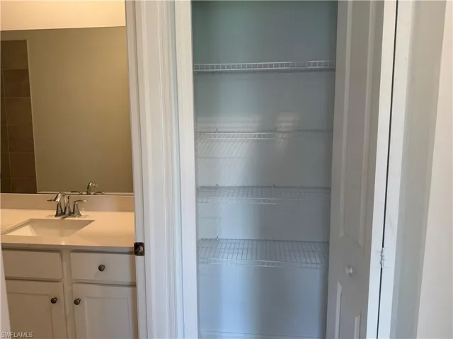 Storage closet next to bathroom