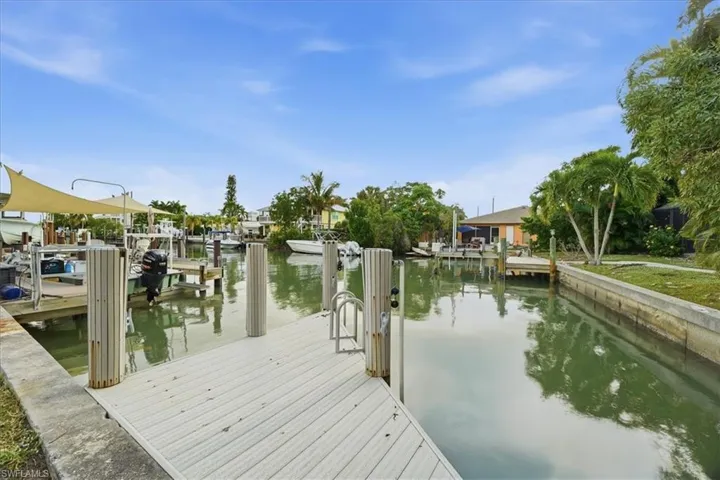 Dock area featuring a water view and boat lift